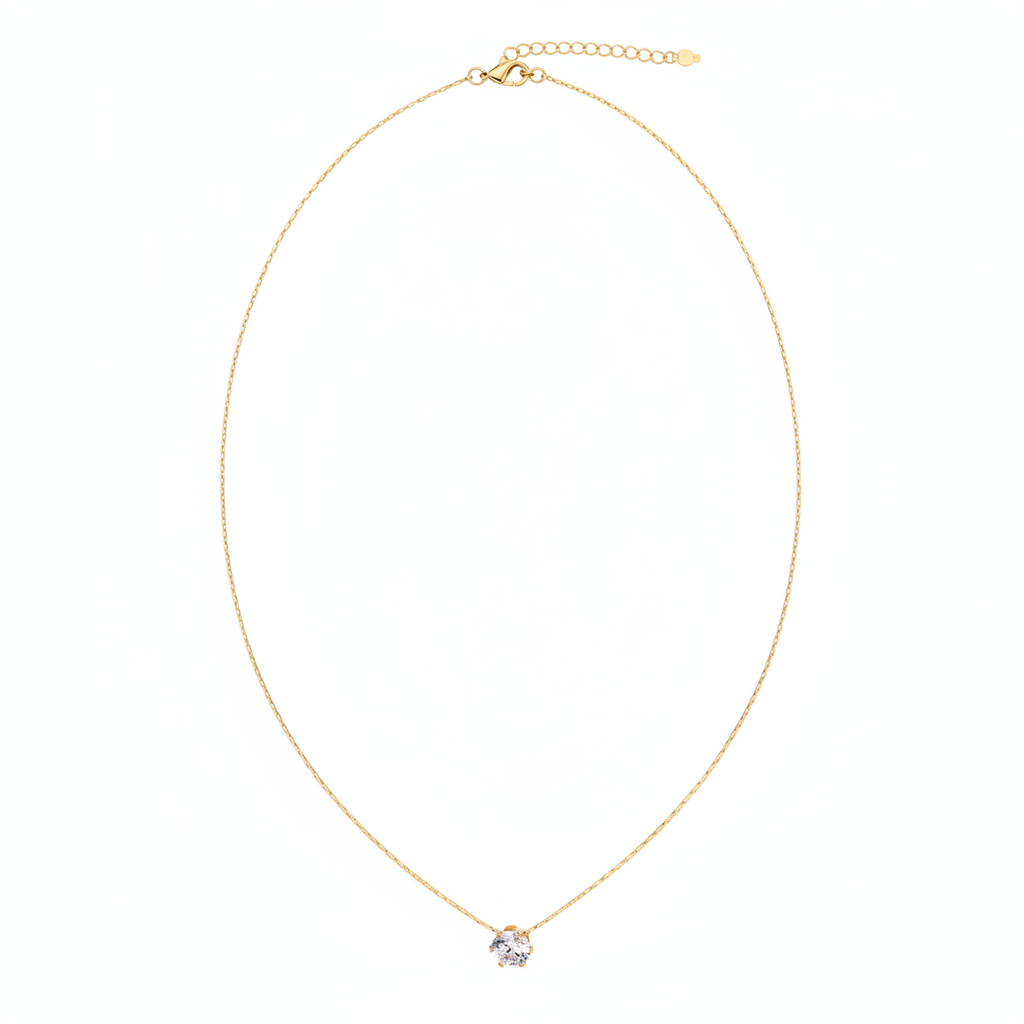 Gold Solitaire Necklace Laid Flat - White Background
